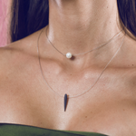 Load image into Gallery viewer, Silver and pearl pendant with double thread feather detail