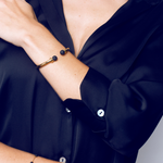Load image into Gallery viewer, Semi rigid gold plated steel bracelet with lava balls