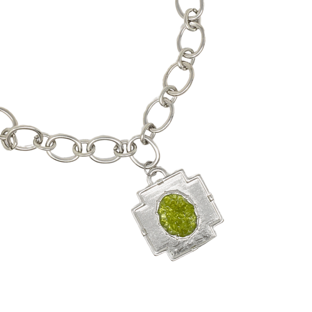 Large peridot cross chain pendant