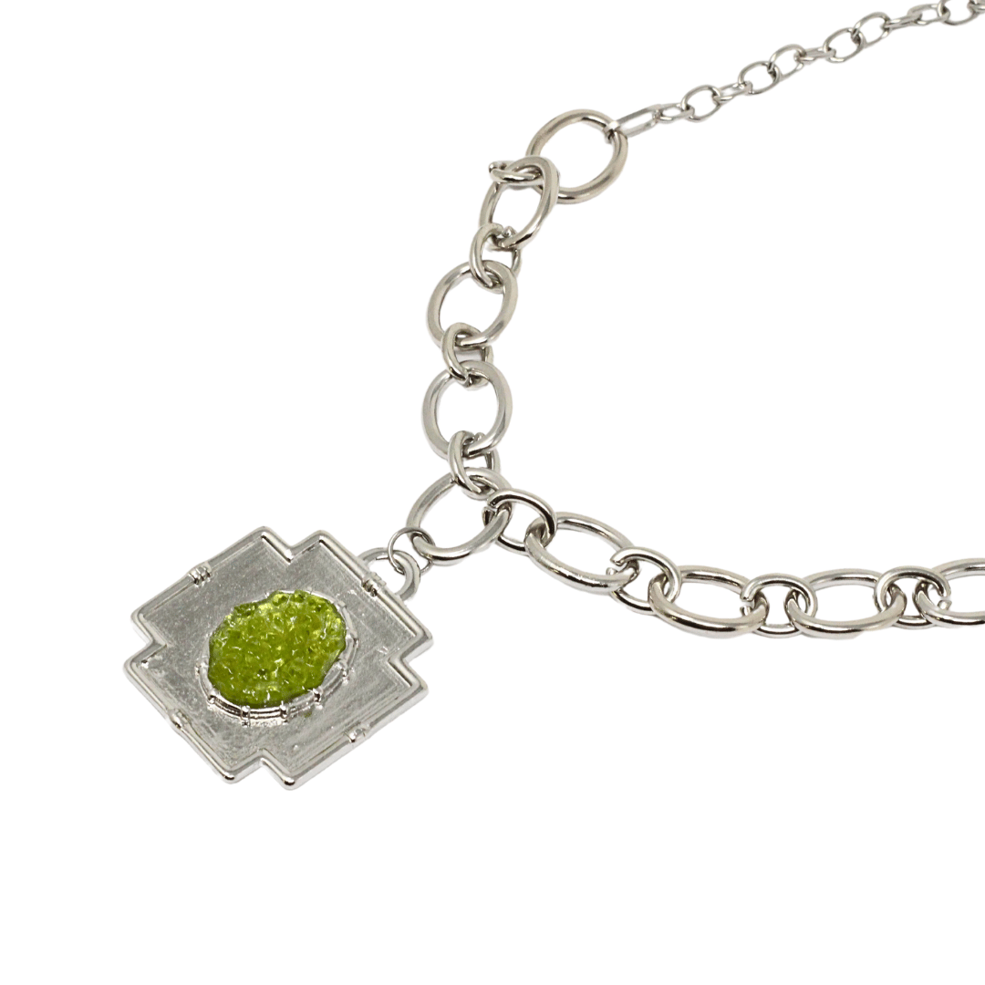 Large peridot cross chain pendant