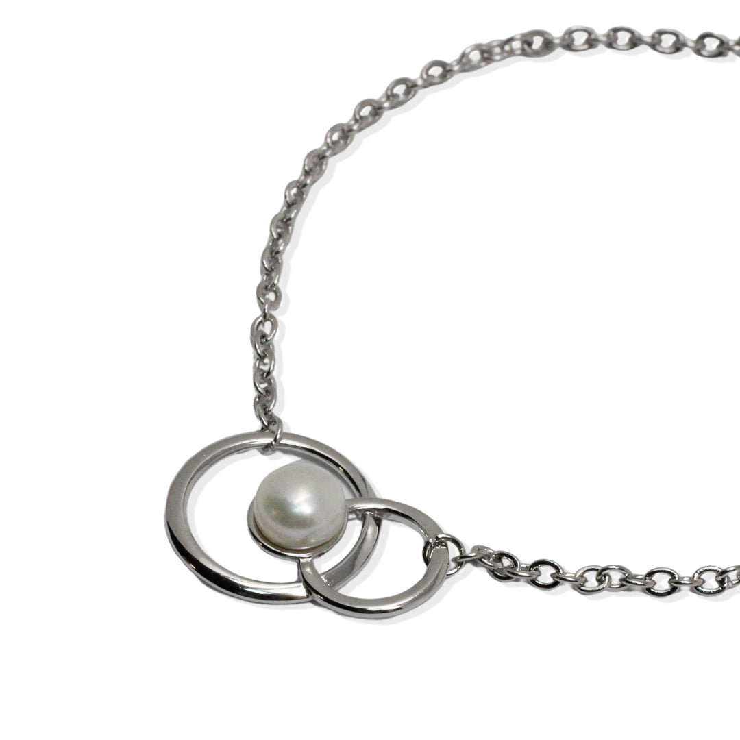 Silver bracelet with double circle of pearls