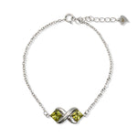 Load image into Gallery viewer, Silver Bracelet with Peridot Set in X Design
