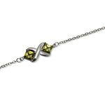 Load image into Gallery viewer, Silver Bracelet with Peridot Set in X Design
