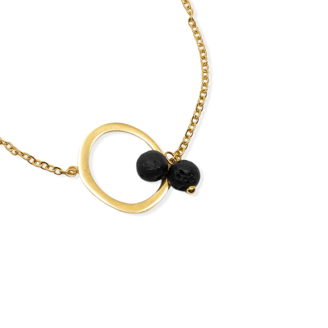 Gold plated steel bracelet with lava ball circle